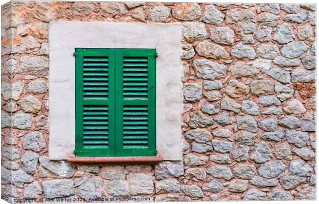 Window shutters and rustic stone wall Canvas Print by Alex Winter