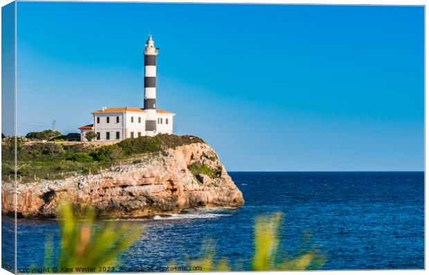 lighthouse at coast cape in Portocolom Canvas Print by Alex Winter