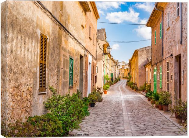 Idyllic street in the mediterranean village Canvas Print by Alex Winter