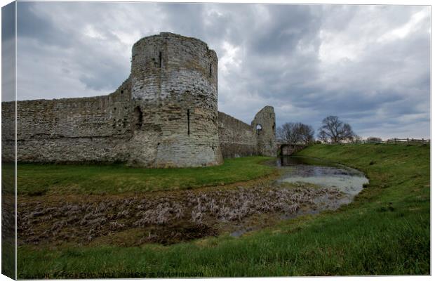 Pevensey Castle under a moody sky Canvas Print by Fiona Etkin
