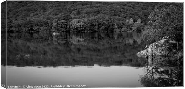 A couple pass in a canoe on Coniston Water Canvas Print by Chris Rose