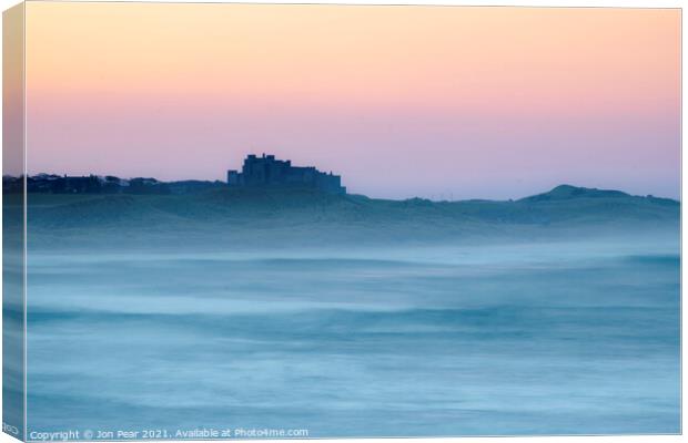  Bamburgh Castle from Seahouses Canvas Print by Jon Pear