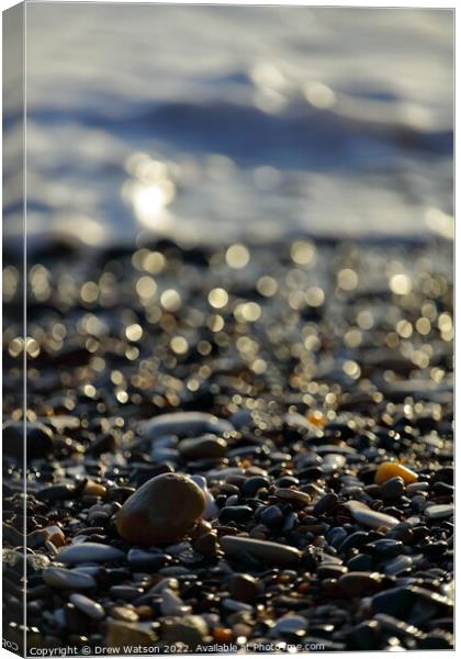 Stones on the beach Canvas Print by Drew Watson