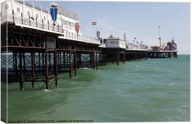 Brighton Pier at high tide Canvas Print by Gordon Dixon