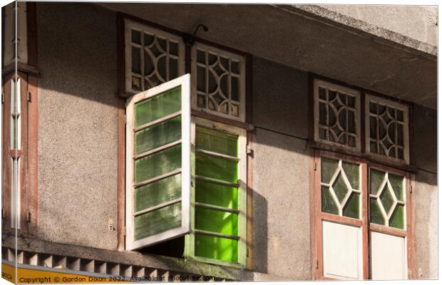 Old green glass windows on an old 'colonial' house in Mumbai, India Canvas Print by Gordon Dixon
