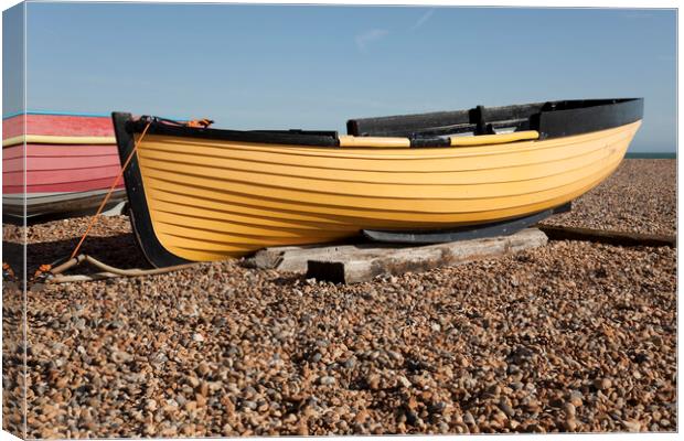 Yellow fishing boat on shingle  - Brighton beach Canvas Print by Gordon Dixon