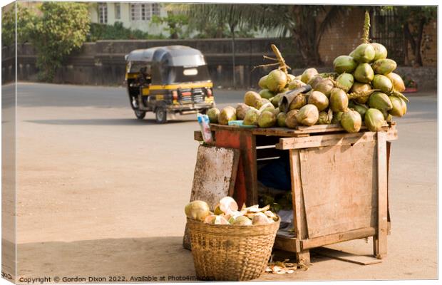 Fresh coconuts for sale on the roadside at Mumbai, India Canvas Print by Gordon Dixon