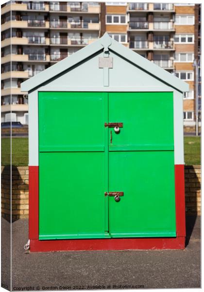 Bright green painted door of a sea front beach hut, Brighton and Hove Canvas Print by Gordon Dixon