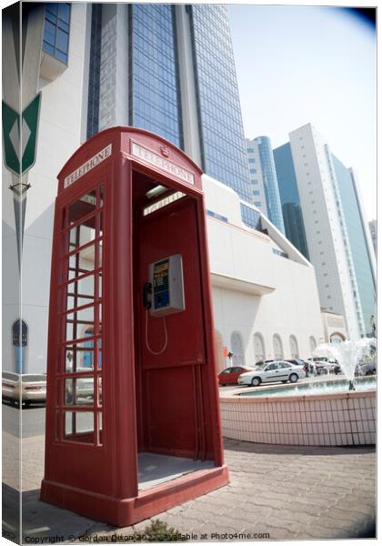 An old British telephone box stood on the pavement in Dubai  Canvas Print by Gordon Dixon