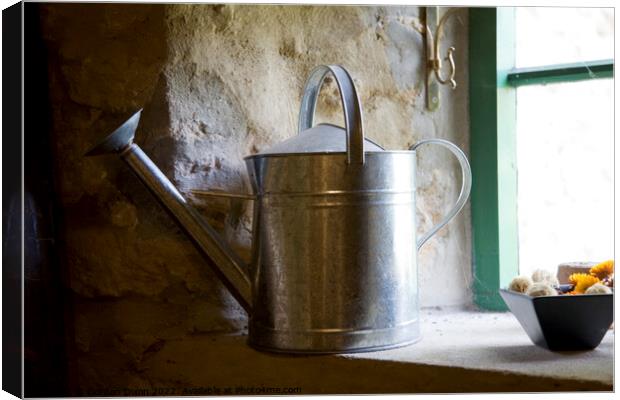 A galvanised watering can sits on a windowsill Canvas Print by Gordon Dixon