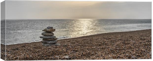 Tranquil beach with stone sculpture and sun on water - Dorset Canvas Print by Gordon Dixon