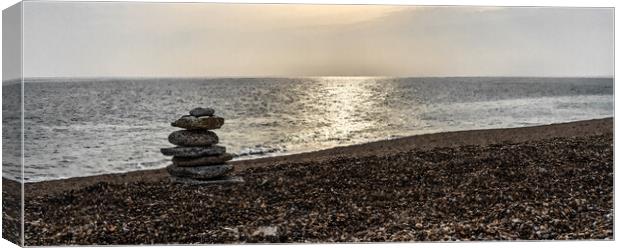 Tranquil beach with stone sculpture and sun on water (watercolour)  - Dorset Canvas Print by Gordon Dixon