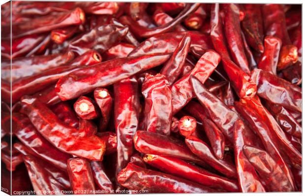 Shiny red dried chillies for sale on a market stall in Seoul, South Korea  Canvas Print by Gordon Dixon