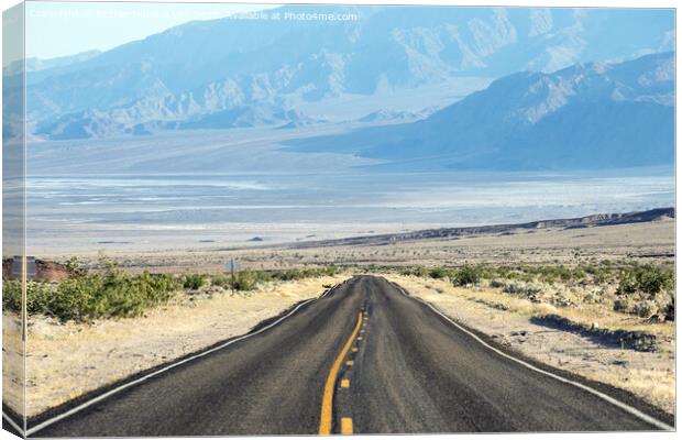 Empty road to the mountains in the United States Canvas Print by Eszter Imrene Virt