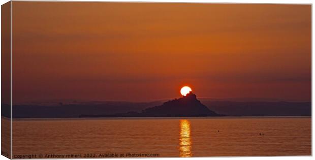 Sun rising over St.Michaels Mount Cornwall. Canvas Print by Anthony miners