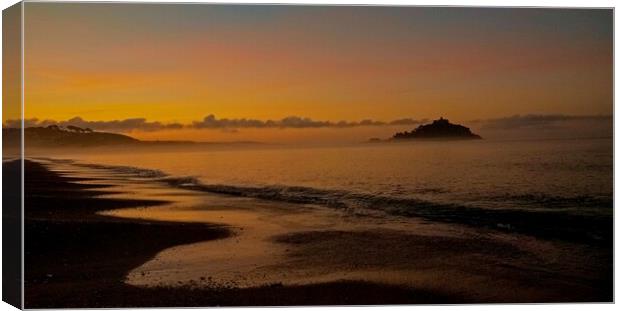 Misty  Sunrise over St.Michaels Mount and Marazion Cornwall . Canvas Print by Anthony miners