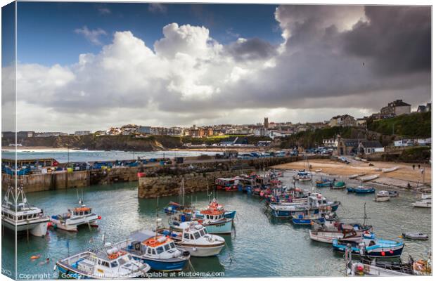 Fishing boats moored in the picturesque Newquay Ha Canvas Print by Gordon Scammell