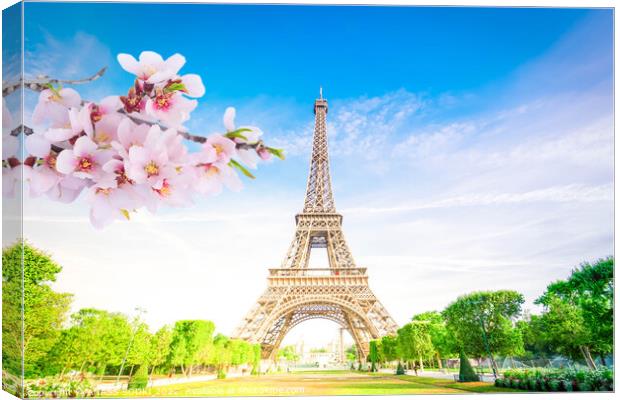 Paris Eiffel Tower over green grass lane and trees in Paris, France. Eiffel Tower is one of the most iconic landmarks of Paris at spring Canvas Print by ANASS SODKI