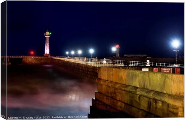 Whitby Lighthouse and Pier Night Shot Canvas Print by Craig Yates