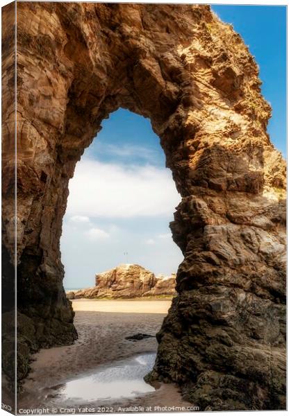 Perranporth Beach Rock Arch Cornwall. Canvas Print by Craig Yates