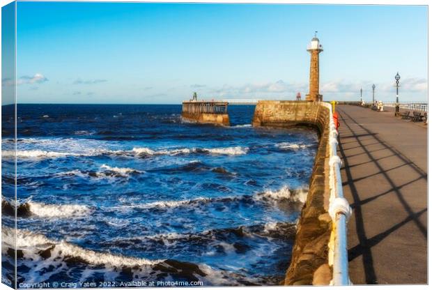 Whitby Lighthouse and Pier Yorkshire. Canvas Print by Craig Yates