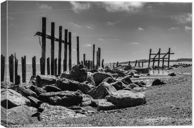 Happisburgh wooden sea defences black and white. Canvas Print by Craig Yates