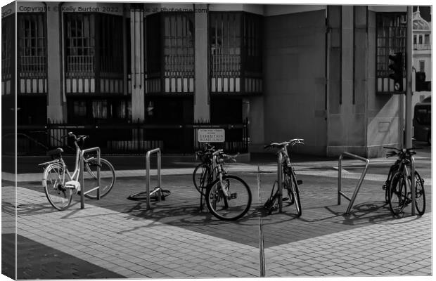 Row of bikes in the street. Canvas Print by Kelly Burton