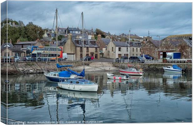 Tranquil Fishing Village Canvas Print by Rodney Hutchinson