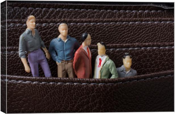 Tiny figurine of men model  in pockets Canvas Print by Turgay Koca