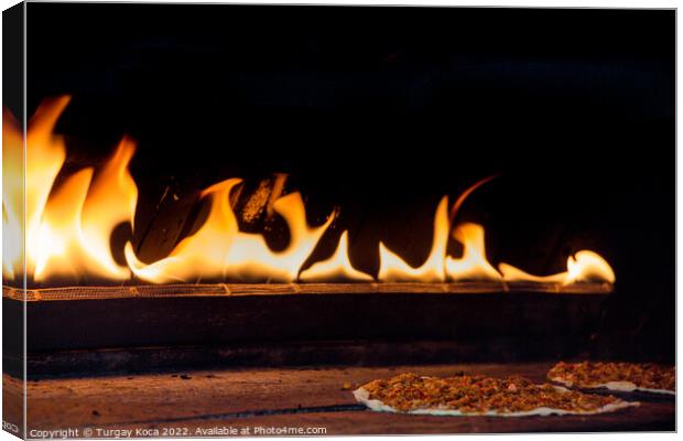 The flames beside a pancake with spicy meat filling Canvas Print by Turgay Koca