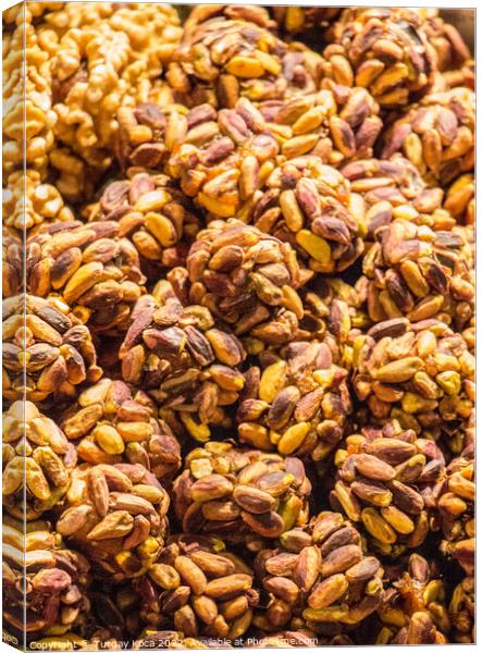 Dozens of Turkish pistachio balls on display Canvas Print by Turgay Koca