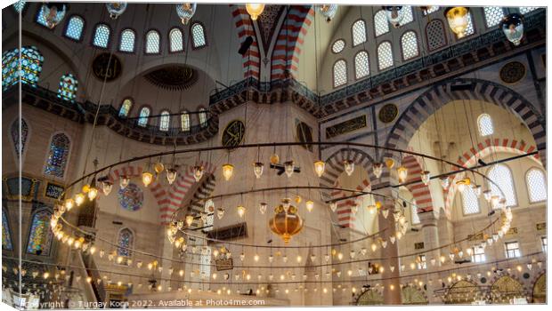 Bright mosque lamps on a circular chandelier Canvas Print by Turgay Koca