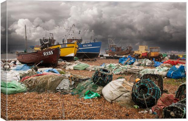 Fishing Boats and Nets on Hastings Beach Canvas Print by Sally Wallis