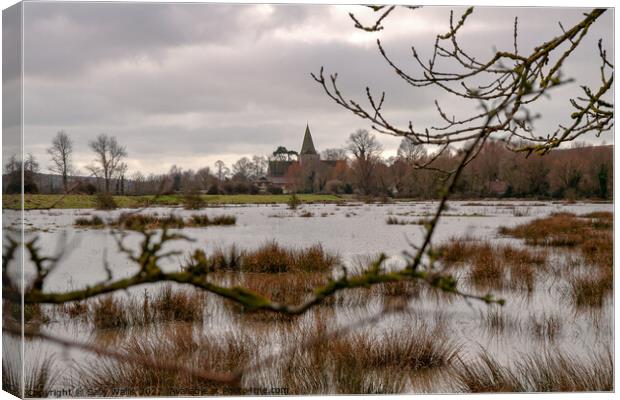 Alfriston church across floods Canvas Print by Sally Wallis