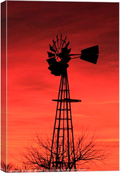 Kansas Sunset with a red Sky and Windmill silhouet Canvas Print by Robert Brozek