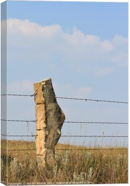 Stone Post fence with a field and blue sky Canvas Print by Robert Brozek