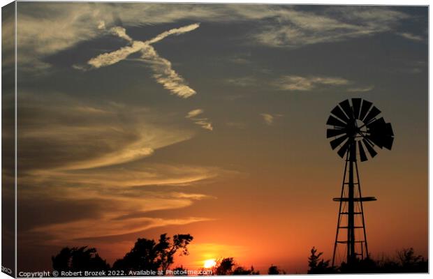 sunset with windmill and sky with cross Canvas Print by Robert Brozek