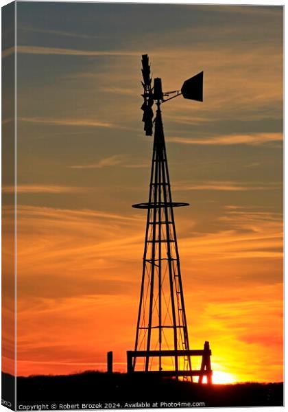 Kansas Golden Sky with clouds with a Farm Windmill silhouette Canvas Print by Robert Brozek