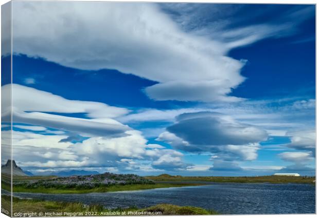 Spectacular UFO clouds in the sky over Iceland - Altocumulus Len Canvas Print by Michael Piepgras