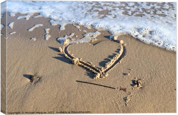 A beautiful heart shape painted into the sand of a baltic sea be Canvas Print by Michael Piepgras