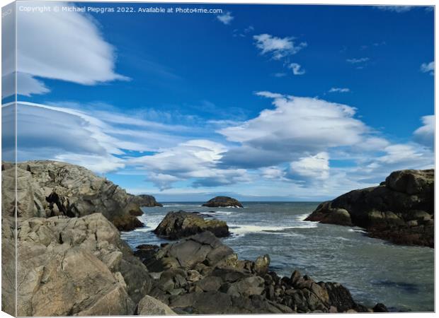 A surf on a rocky beach with black sand in Iceland. Canvas Print by Michael Piepgras