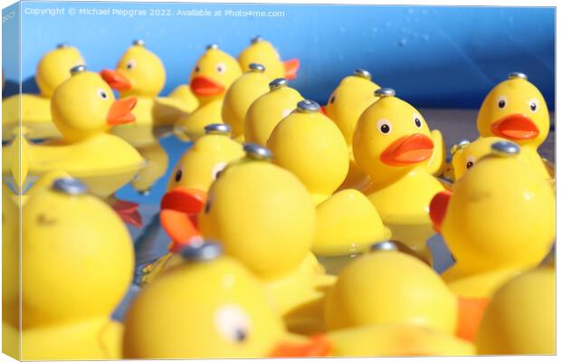 Selective focus. Many yellow rubber ducks swimming in circles in Canvas Print by Michael Piepgras
