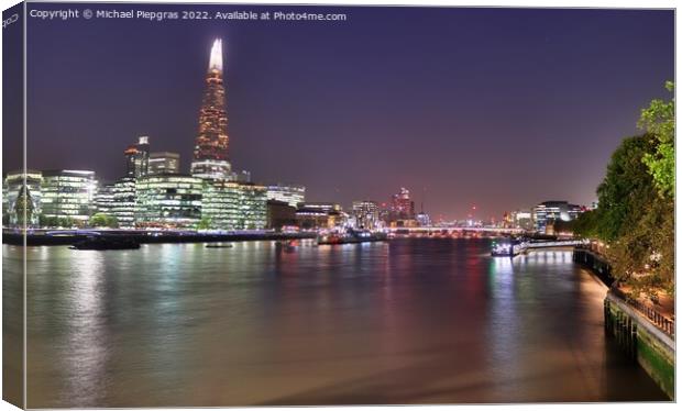 View at the River Thames in the city of London at night Canvas Print by Michael Piepgras