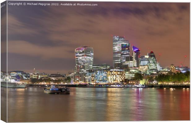 View at the River Thames in the city of London at night Canvas Print by Michael Piepgras