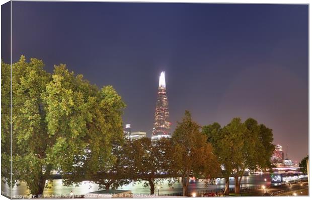 View of the London skyline at night with river thamse and lots of light Canvas Print by Michael Piepgras