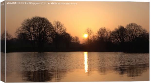 Beautiful and romantic sunset at a lake in stunning yellow and o Canvas Print by Michael Piepgras