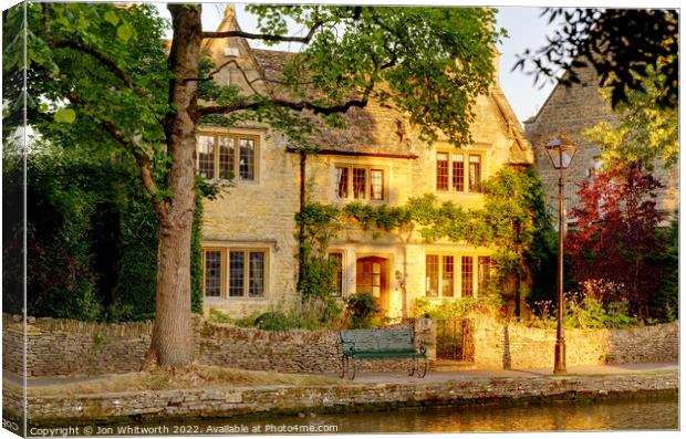 Picturesque house at Bourton Canvas Print by Jon Whitworth