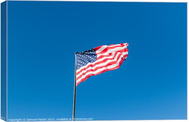 American USA Flag flying on a clear blue sky Canvas Print by Samuel Foster