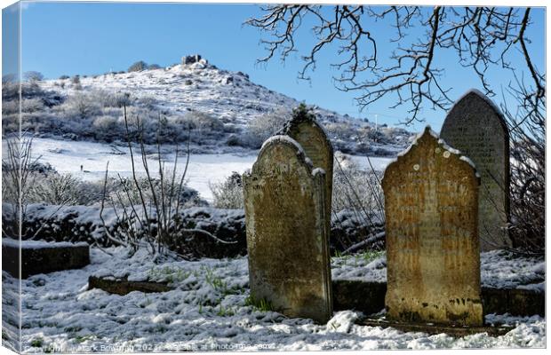 Snow covered gravestones Canvas Print by Mark Bowman