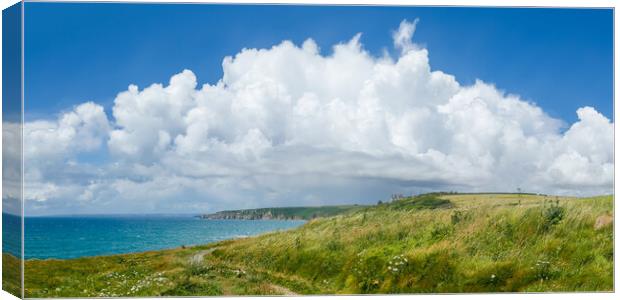 Cumulus Clouds over Beacon Crag, Porthleven Canvas Print by Adrian Burgess